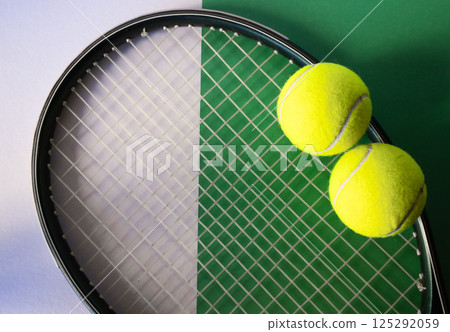 Racket and balls set on green and white background, flat lay. Isolated. 125292059