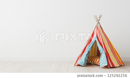 Children's play tent beside blank white wall with text space 125292258