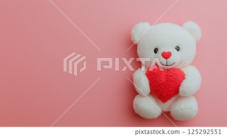White Teddy Bear Holding Red Heart on Pink Background 125292551