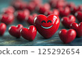 Cute red smiling smiley face in the shape of a heart 125292654