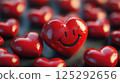 Cute laughing smiley face in the shape of a heart among many hearts 125292656
