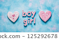 Blue background with hearts and the words boy and girl.  The flyer is an invitation to the Gender reveal party. 125292678