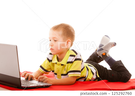 Education, technology internet - little boy with laptop Education, technology internet - little boy with laptop 125292760