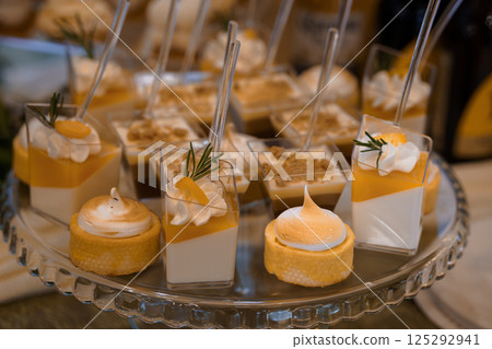 Exquisite Display of Elegant Desserts Featuring Mousse, Pudding, and Tart Variations Exquisite Display of Elegant Desserts Featuring Mousse, Pudding, and Tart Variations 125292941