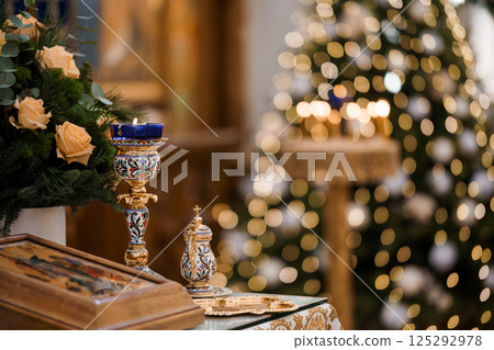 Serene Christmas Altar with Ornate Decor and Glowing Candles Serene Christmas Altar with Ornate Decor and Glowing Candles 125292978