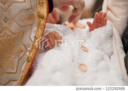 Christening Ceremony with Infants in Traditional Garb 125292986