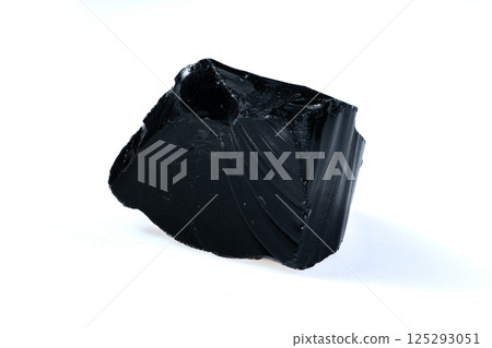 Natural Black Volcanic Obsidian Stone Fragment Isolated on White Background Natural Black Volcanic Obsidian Stone Fragment Isolated on White Background 125293051