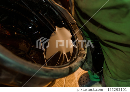 Oil Drainage Process in a Workshop Setting Oil Drainage Process in a Workshop Setting 125293101
