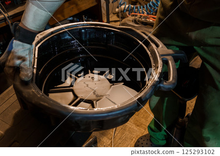 Industrial Oil Collection in Workshop Setting Industrial Oil Collection in Workshop Setting 125293102