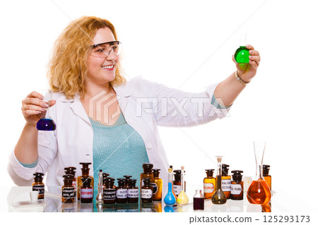 female chemistry student with glassware test flask. 125293173