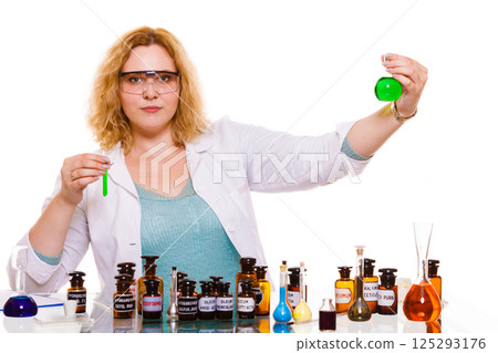 female chemistry student with glassware test flask. 125293176