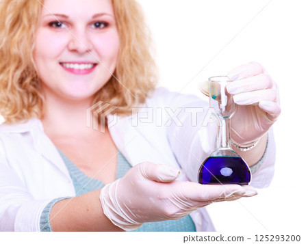 Chemist woman holds test flask Chemist woman holds test flask 125293200