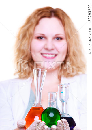 Chemist woman holds test flask Chemist woman holds test flask 125293201