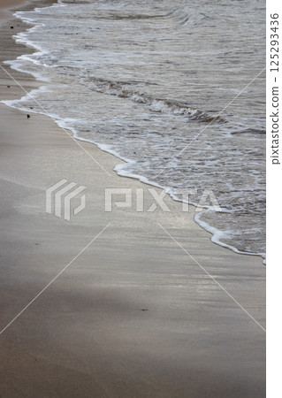 Sand beach and a line of the tide, Gran Canaria, Spain 125293436