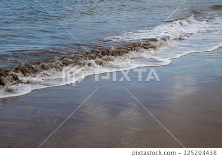 Sand beach and a line of the tide, Gran Canaria, Spain 125293438