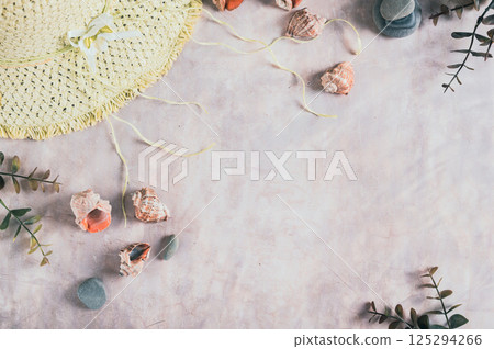 Travel background, hat, shells, stones and branches top view 125294266