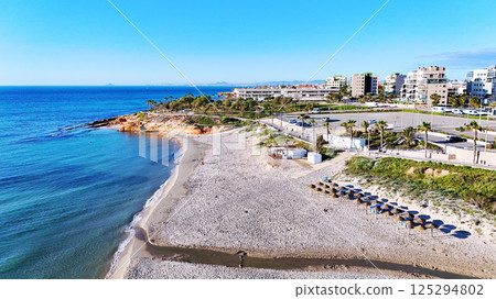 Aerial shot of spanish resort town of Mil Palmeras. Costa Blanca. Spain Aerial shot of spanish resort town of Mil Palmeras. Costa Blanca. Spain 125294802