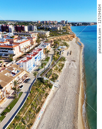 Aerial shot of spanish resort town of Mil Palmeras. Costa Blanca. Spain Aerial shot of spanish resort town of Mil Palmeras. Costa Blanca. Spain 125294804