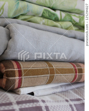 Folds Of Cozy Domestic Variety Size And Colors Bedding In Home Closet  125294827