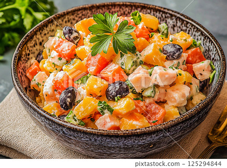 Colorful salad with fresh herbs, ideal for a summer gathering or picnic Colorful salad with fresh herbs, ideal for a summer gathering or picnic 125294844