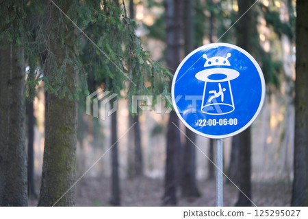 A road sign warning that aliens may land in the park A road sign warning that aliens may land in the park 125295027