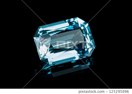 faceted aquamarine stone on a black background 125295896