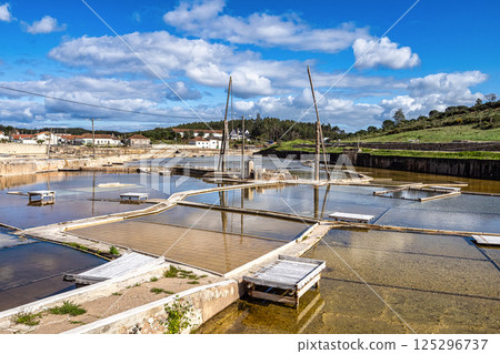 Fonte da Bica Salt Flats, Salinas de Rio Maior in Portugal, shallow water compartments and gutters for salt extraction Fonte da Bica Salt Flats, Salinas de Rio Maior in Portugal, shallow water compartments and gutters for salt extraction 125296737
