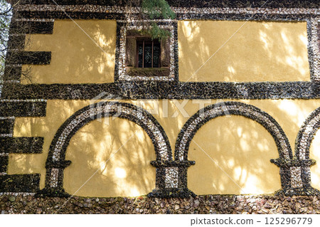 Calvary chapel in the way to the cross, via crucis, trail on ancient forest of Bussaco, in Luso, Aveiro in Portugal. 125296779