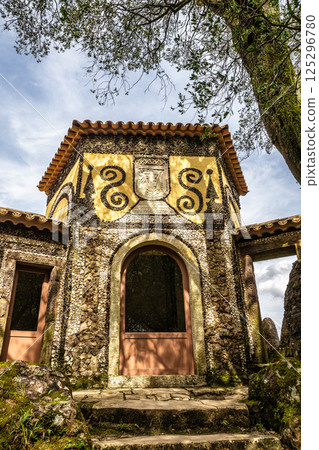 Calvary chapel in the way to the cross, via crucis, trail on ancient forest of Bussaco, in Luso, Aveiro in Portugal. 125296780