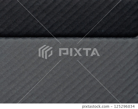 Textured fabric in varying shades of gray with subtle pattern detail 125296834