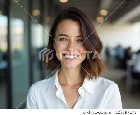A cheerful brunette woman stands confidently in a modern bank office, delivering exceptional service with a bright smile. The setting conveys professionalism and warmth Generative AI 125297172
