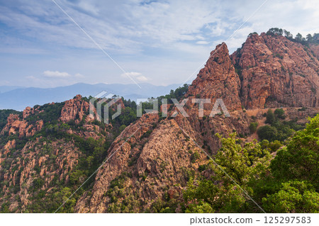 A breathtaking view of rocky hills covered with green foliage, Corsica 125297583