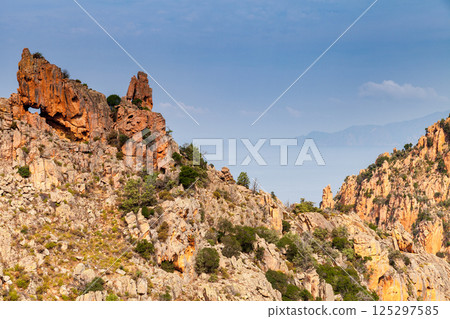 A dramatic rocky landscape featuring unique formations of Piana, Corsica A dramatic rocky landscape featuring unique formations of Piana, Corsica 125297585