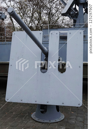 Kiev, Ukraine December 10, 2020: Shipborne semi-automatic universal gun 21-K caliber 45 mm in the Museum of Military Equipment for all to see 125297907