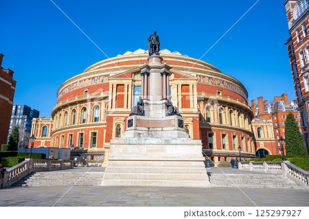 Monument commemorating the Great Exhibition of 1851 stands prominently in front of Royal Albert Hall, surrounded by a clear blue sky and a serene atmosphere, inviting visitors to reflect. Monument commemorating the Great Exhibition of 1851 stands prominently in front of Royal Albert Hall, surrounded by a clear blue sky and a serene atmosphere, inviting visitors to reflect. 125297927