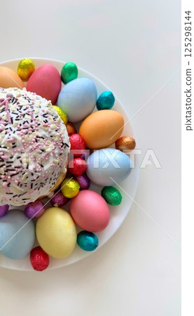 Colorful Easter celebration with decorated eggs and sweet treats for joyful festivities concept 125298144