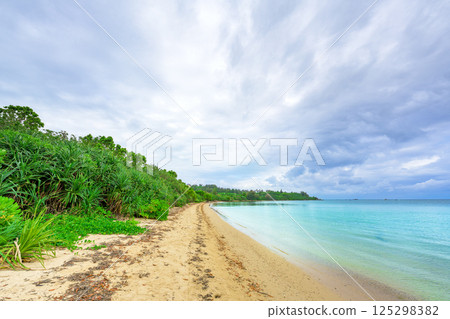 A tranquil beach scene on Ishigaki Island, sparkling with emerald green light A tranquil beach scene on Ishigaki Island, sparkling with emerald green light 125298382