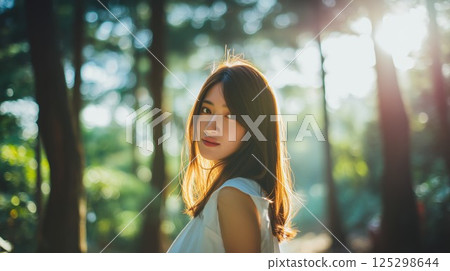 Beautiful woman portrait with forest background 125298644