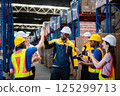 Teamwork of warehouse workers	 125299713