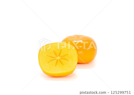 Okesa persimmon from Niigata Prefecture, seedless, cut, cross section Okesa persimmon from Niigata Prefecture, seedless, cut, cross section 125299751