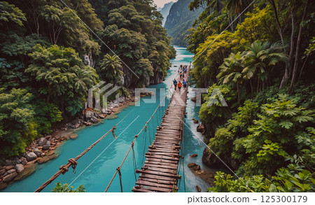 Group of people are walking across a wooden bridge over a river. The bridge is surrounded by lush green trees and the water is a beautiful shade of blue. The scene is peaceful and serene Group of people are walking across a wooden bridge over a river. The bridge is surrounded by lush green trees and the water is a beautiful shade of blue. The scene is peaceful and serene 125300179