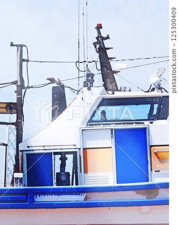 Fishing port scenery Wheelhouse [Vertical composition] 125300409