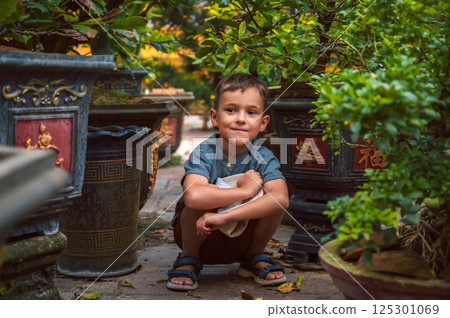 Portrait of happy caucasian schoolboy child boy on park in summer 125301069