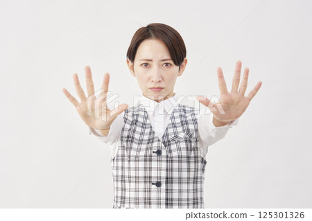 Female office worker stop gesture white background 125301326