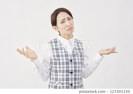 Female office worker gesture of giving up, white background 125301330