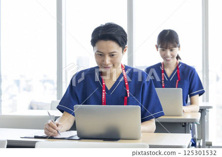 Medical: Medical professionals attending a seminar in a conference room. Photo courtesy of Denpa Gakuen, Tokyo Electronics College 125301532