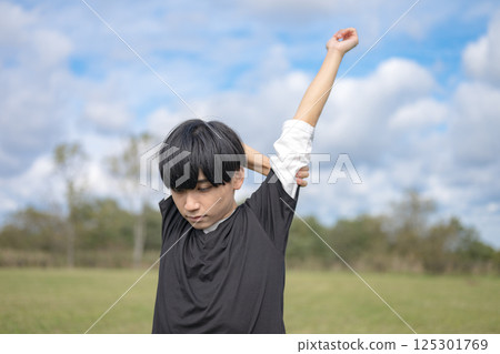 Man stretching his body Man stretching his body 125301769