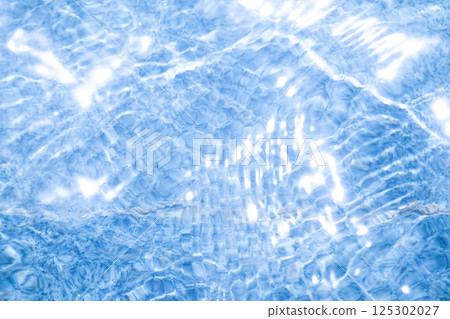 Blue water surface and sparkling light vertical composition 125302027