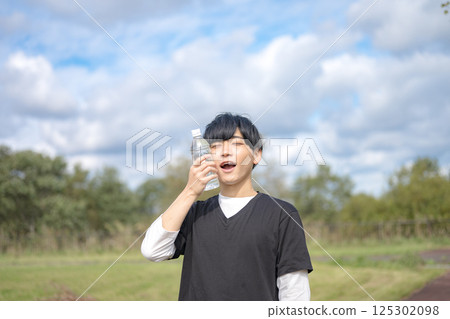 A refreshing man cooling his face A refreshing man cooling his face 125302098
