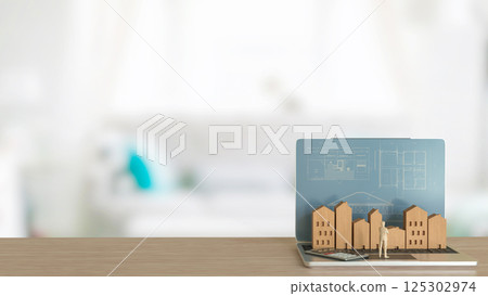 The Man and wood house on Notebook for property or real estate concept 3d Rendering. The Man and wood house on Notebook for property or real estate concept 3d Rendering. 125302974